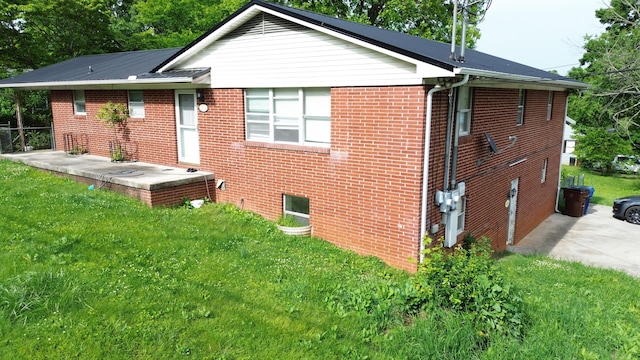 2014 Eastview Ave, Jefferson City, TN 37760 - view of side of property featuring brick siding and a yard