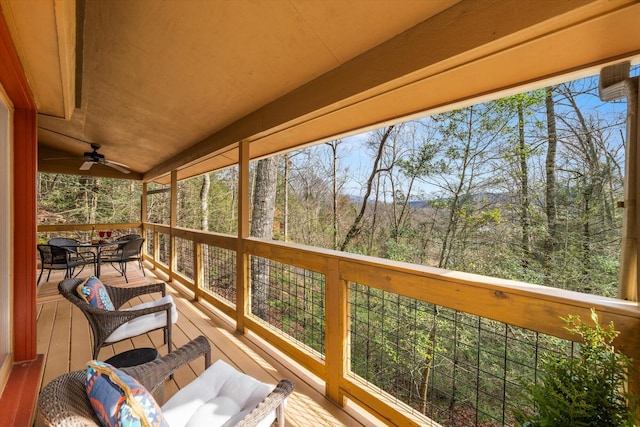 deck featuring a ceiling fan and outdoor dining space