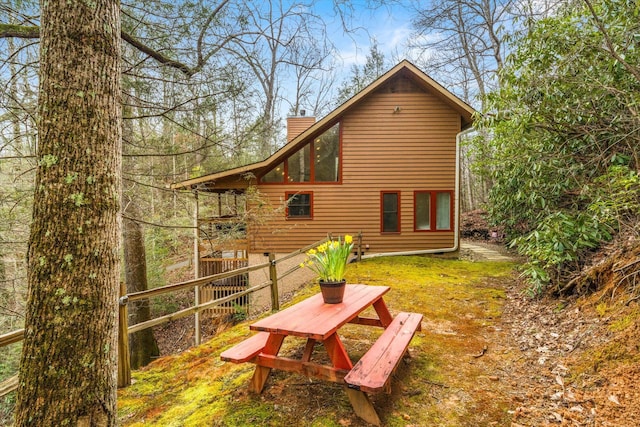 back of property featuring a chimney