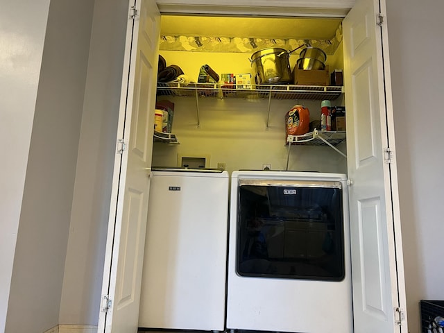 laundry room featuring washer and clothes dryer