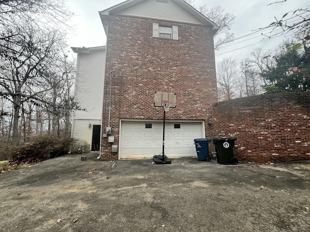 view of side of home with a garage