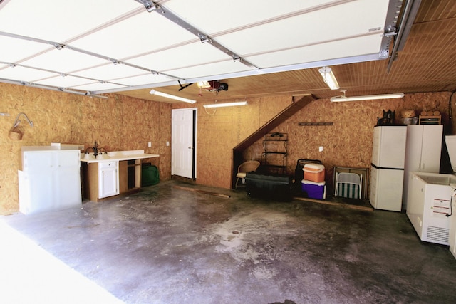 5780 Catawba Ln, Morristown, TN 37814 - garage featuring freestanding refrigerator and a garage door opener