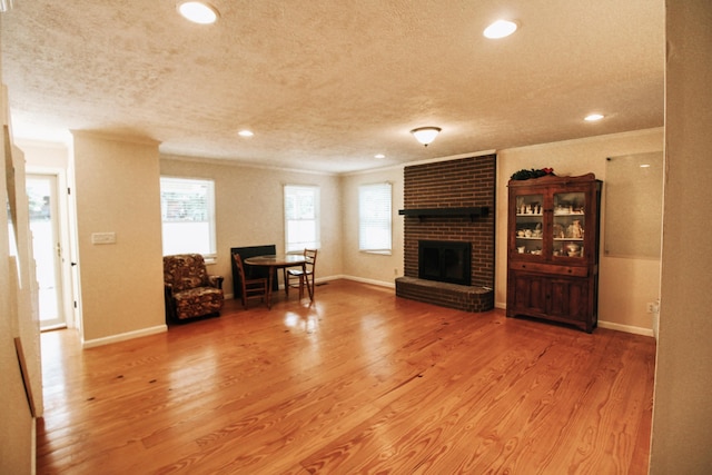 5780 Catawba Ln, Morristown, TN 37814 - living room with a fireplace, a textured ceiling, ornamental molding, wood finished floors, and recessed lighting