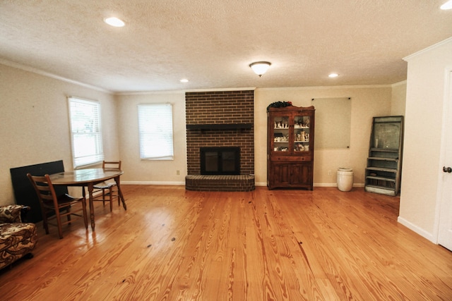 5780 Catawba Ln, Morristown, TN 37814 - living room featuring crown molding, a textured ceiling, a brick fireplace, wood finished floors, and recessed lighting