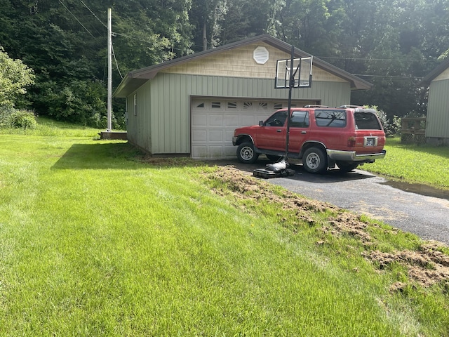 garage featuring a lawn