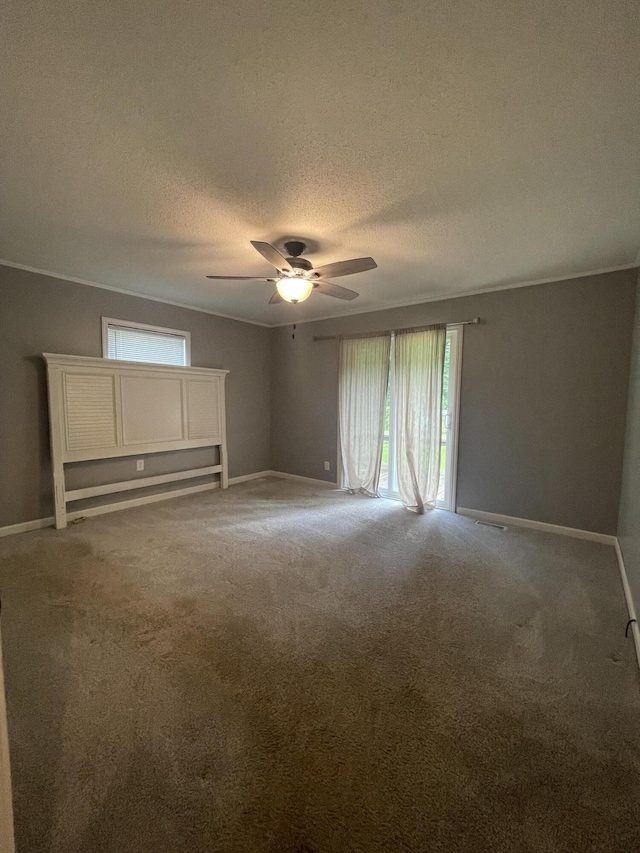 unfurnished room featuring carpet, a textured ceiling, and ceiling fan