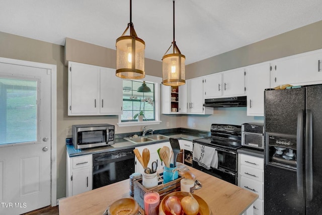 kitchen featuring white cabinetry, a sink, under cabinet range hood, and black appliances