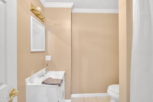 half bathroom featuring a textured ceiling, vanity, toilet, ornamental molding, and tile patterned flooring