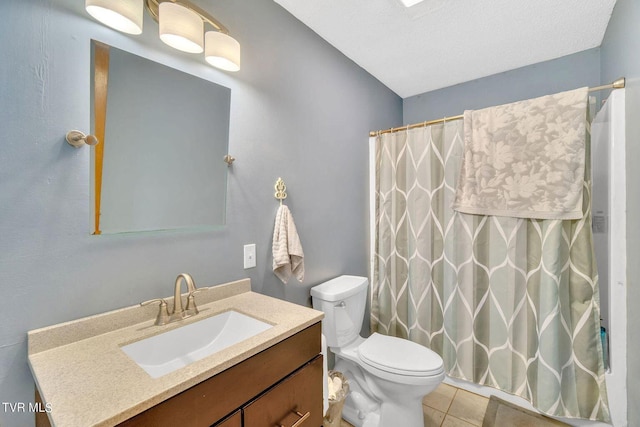 bathroom with a shower with shower curtain, toilet, vanity, and tile patterned floors