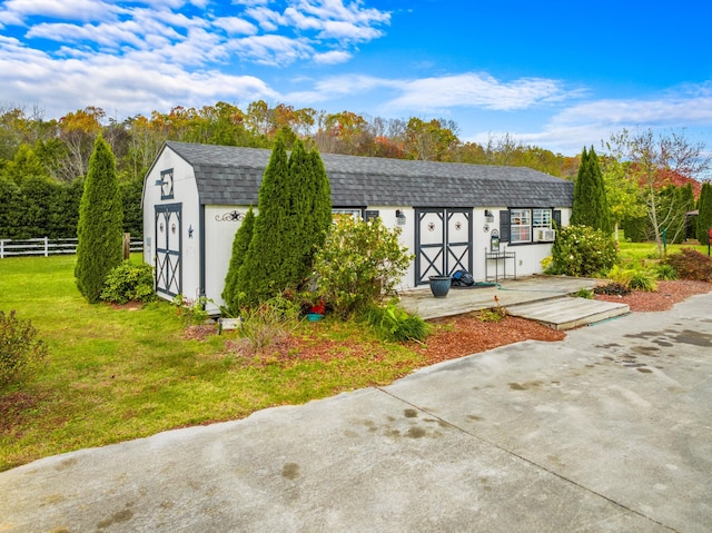 exterior space with a front yard and a storage unit