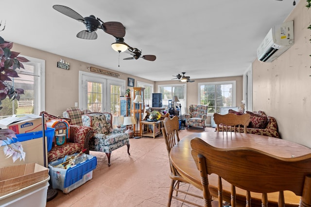 dining space with ceiling fan, an AC wall unit, and french doors