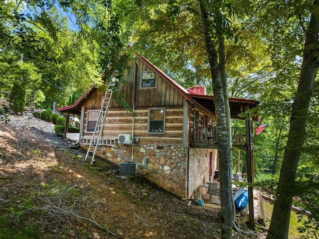 1055 Dean Cir, Dandridge, TN 37725 - view of home's exterior with stone siding and a cooling unit