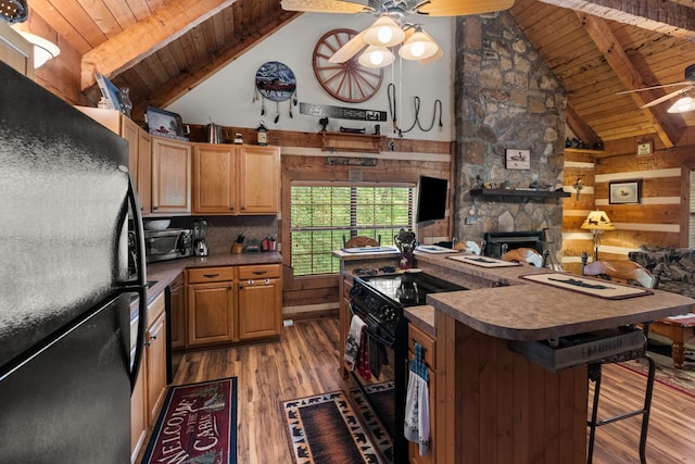 1055 Dean Cir, Dandridge, TN 37725 - kitchen featuring black appliances, ceiling fan, a wood ceiling with exposed beams, light wood finished floors, and high vaulted ceiling