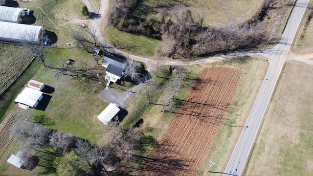 birds eye view of property with a rural view