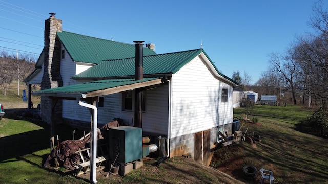 rear view of house with a lawn