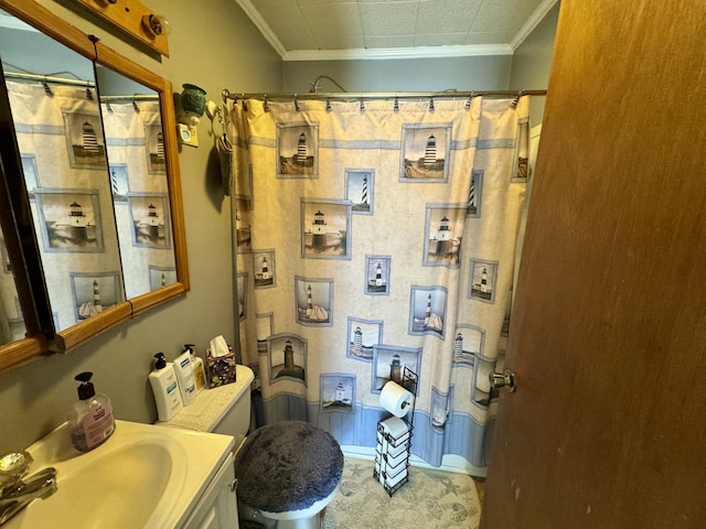 full bath featuring curtained shower, vanity, and crown molding