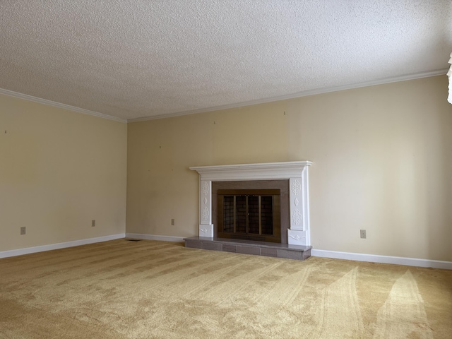 unfurnished living room with ornamental molding, a textured ceiling, carpet, baseboards, and a tile fireplace