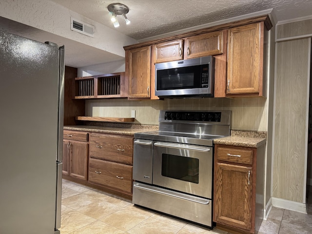 kitchen with visible vents, open shelves, a textured ceiling, stainless steel appliances, and decorative backsplash