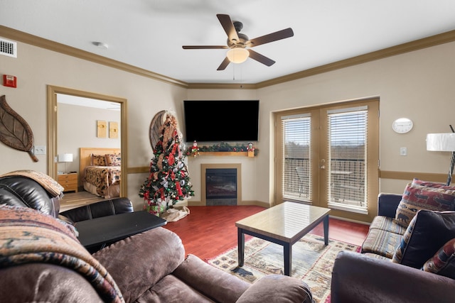 living room featuring wood-type flooring, french doors, ceiling fan, and crown molding