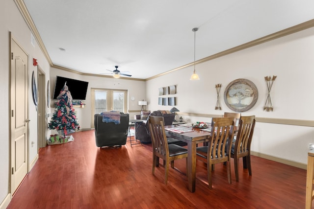 dining space with crown molding, hardwood / wood-style floors, and ceiling fan