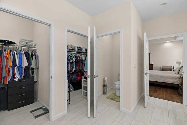 2139 Rainwater Rd, Dandridge, TN 37725 - bedroom featuring multiple closets and light wood-type flooring