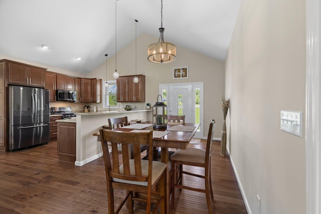 2139 Rainwater Rd, Dandridge, TN 37725 - dining space featuring high vaulted ceiling, dark wood-style flooring, and a chandelier