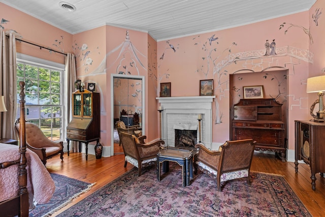 1130 Squirewood Way, Dandridge, TN 37725 - living area with hardwood / wood-style floors, crown molding, and a brick fireplace