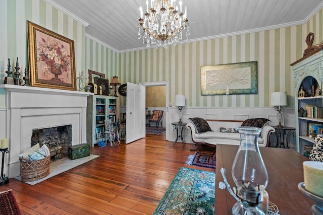 1130 Squirewood Way, Dandridge, TN 37725 - living room featuring ornamental molding, a wainscoted wall, hardwood / wood-style floors, a chandelier, and a fireplace with flush hearth