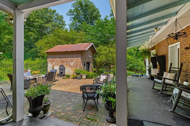 1130 Squirewood Way, Dandridge, TN 37725 - view of patio / terrace with outdoor lounge area and an outbuilding