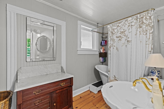1130 Squirewood Way, Dandridge, TN 37725 - full bathroom with baseboards, wood finished floors, healthy amount of natural light, ornamental molding, and a sink