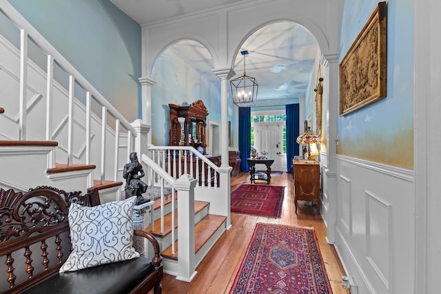1130 Squirewood Way, Dandridge, TN 37725 - foyer with a decorative wall, decorative columns, wood-type flooring, stairs, and a wainscoted wall