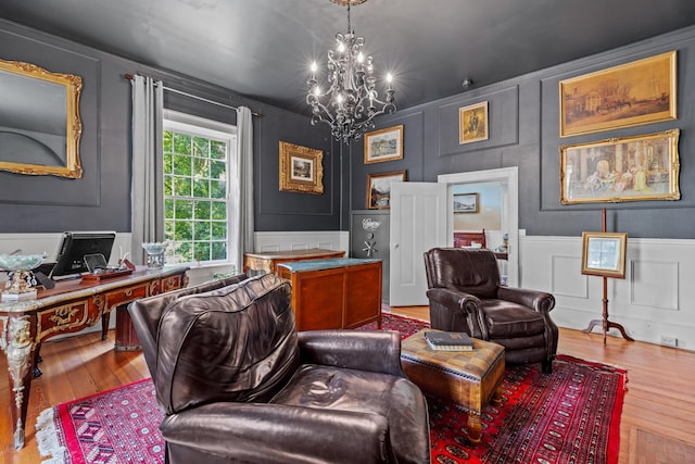 1130 Squirewood Way, Dandridge, TN 37725 - home office featuring a decorative wall, wood-type flooring, a chandelier, and wainscoting