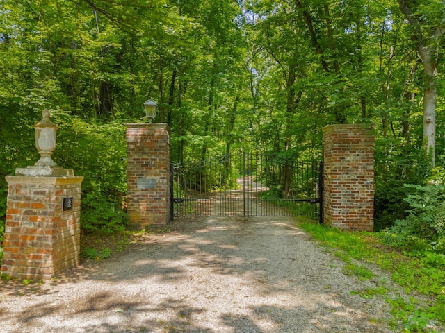 1130 Squirewood Way, Dandridge, TN 37725 - gate featuring a wooded view