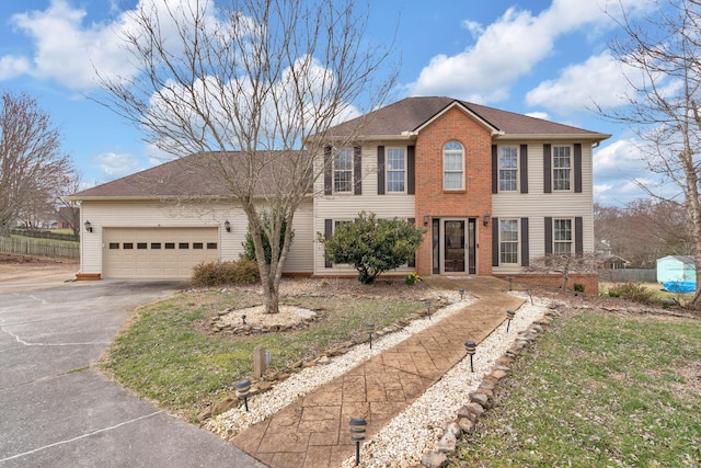 4813 Walnut Hill Dr, Morristown, TN 37814 - view of front of house with driveway, a garage, and brick siding