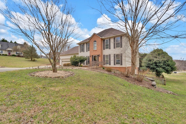 4813 Walnut Hill Dr, Morristown, TN 37814 - colonial home featuring brick siding, a front lawn, and an attached garage