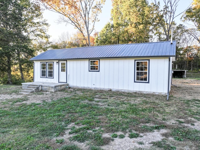 view of outbuilding with a yard