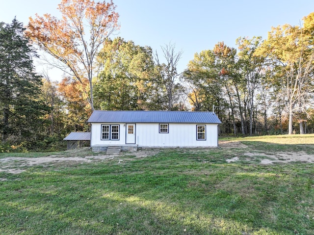 view of outbuilding featuring a yard