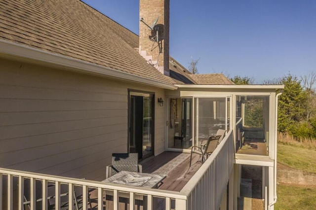 wooden terrace with a sunroom