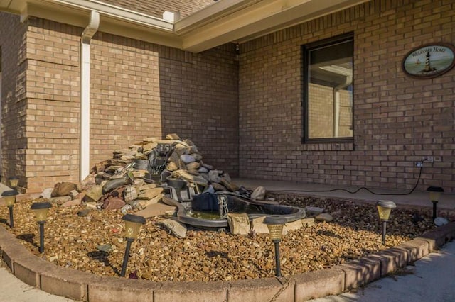 view of side of property with brick siding