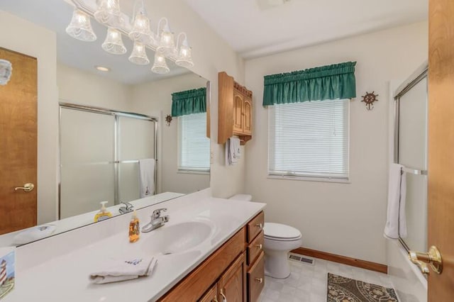 bathroom featuring visible vents, toilet, vanity, and baseboards