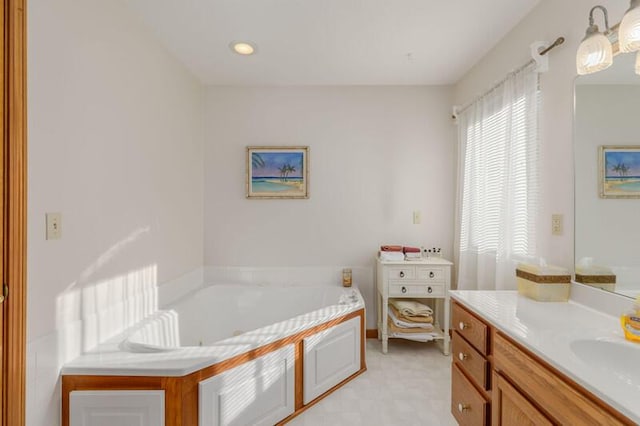 bathroom featuring recessed lighting, a garden tub, vanity, and tile patterned floors