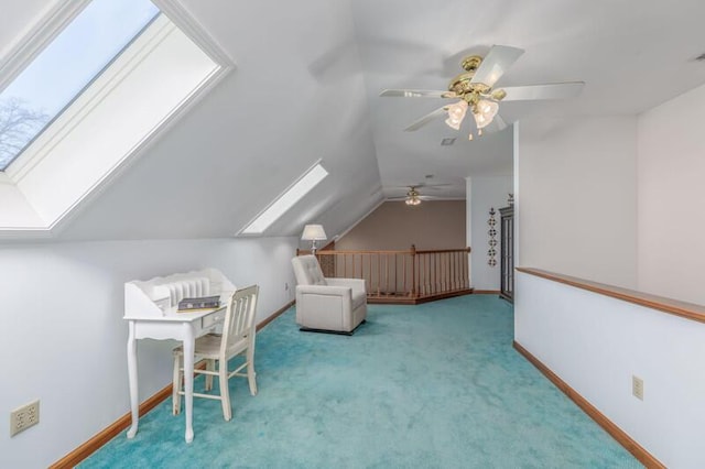 bonus room featuring carpet floors, vaulted ceiling with skylight, and baseboards