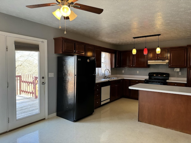 kitchen featuring sink, hanging light fixtures, black appliances, dark brown cabinets, and a textured ceiling