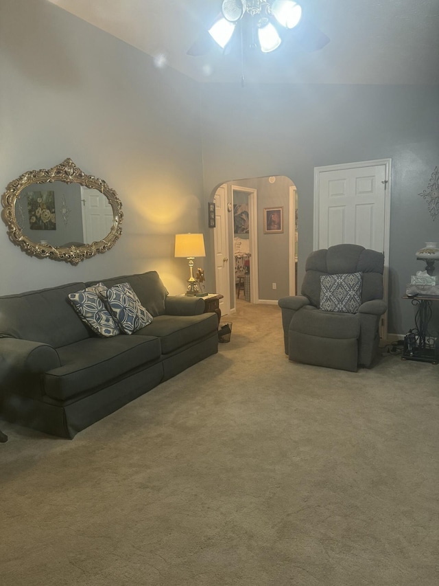 living room with high vaulted ceiling and carpet flooring