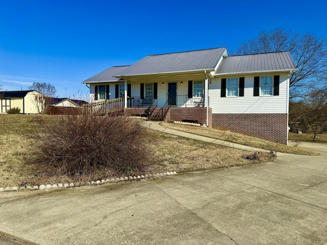 single story home featuring covered porch