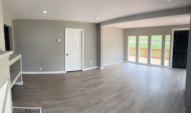 unfurnished living room with hardwood / wood-style flooring