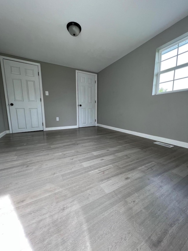 unfurnished room featuring light hardwood / wood-style floors