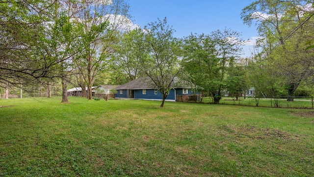 view of yard with fence