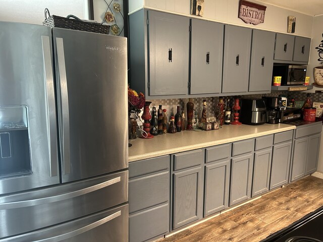 281 Webb Rd, Rogersville, TN 37857 - kitchen featuring appliances with stainless steel finishes, gray cabinets, light countertops, and light wood finished floors