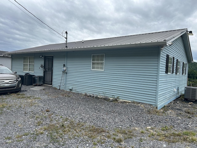 281 Webb Rd, Rogersville, TN 37857 - rear view of house featuring metal roof and central AC